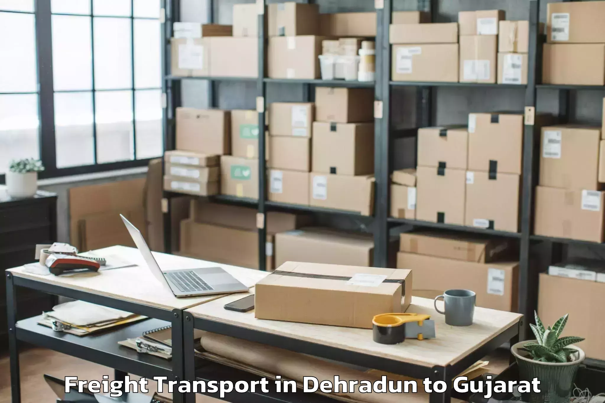 Book Dehradun to Malpur Freight Transport